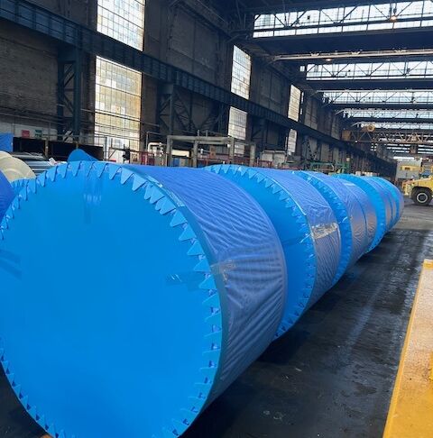 Steel coils packed with Blue Edge edge protection, side protection and WrapWeave in the warehouse.