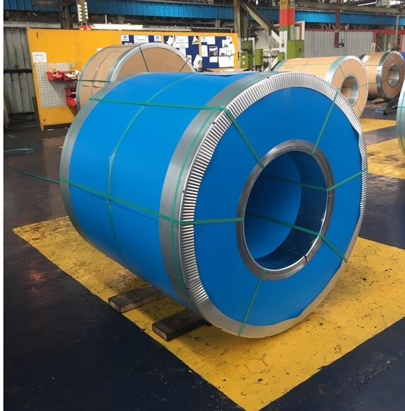 Steel coils packed with blue side protection and corrugated outer edge protection in the warehouse.