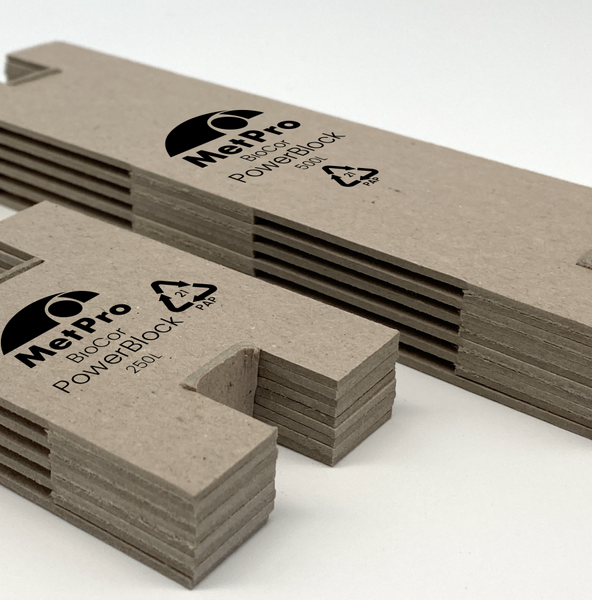 BioCor® PowerBlock VCI dispensers made of gray cardboard with black MetPro printing, arranged side by side, sizes 250L and 500L.