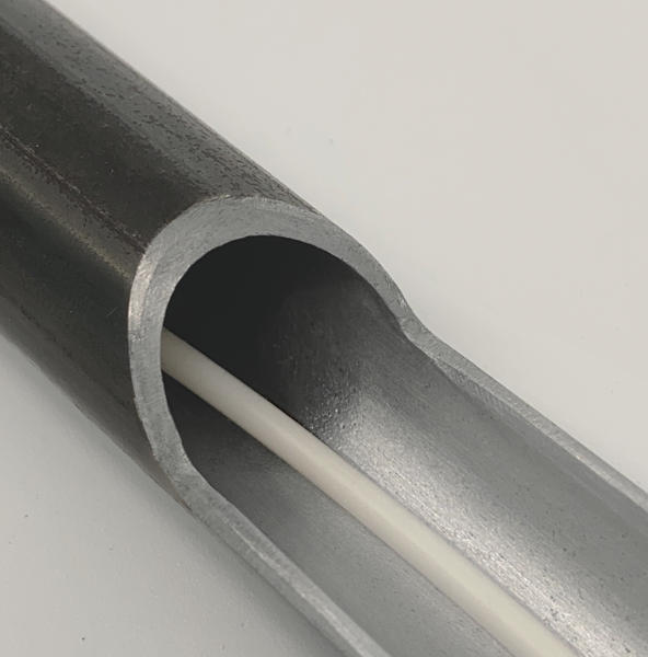 Cross-sectional view of a metal tube containing an internal white BioCor® corrosion protection cable with a high VCI content for maximum protection.